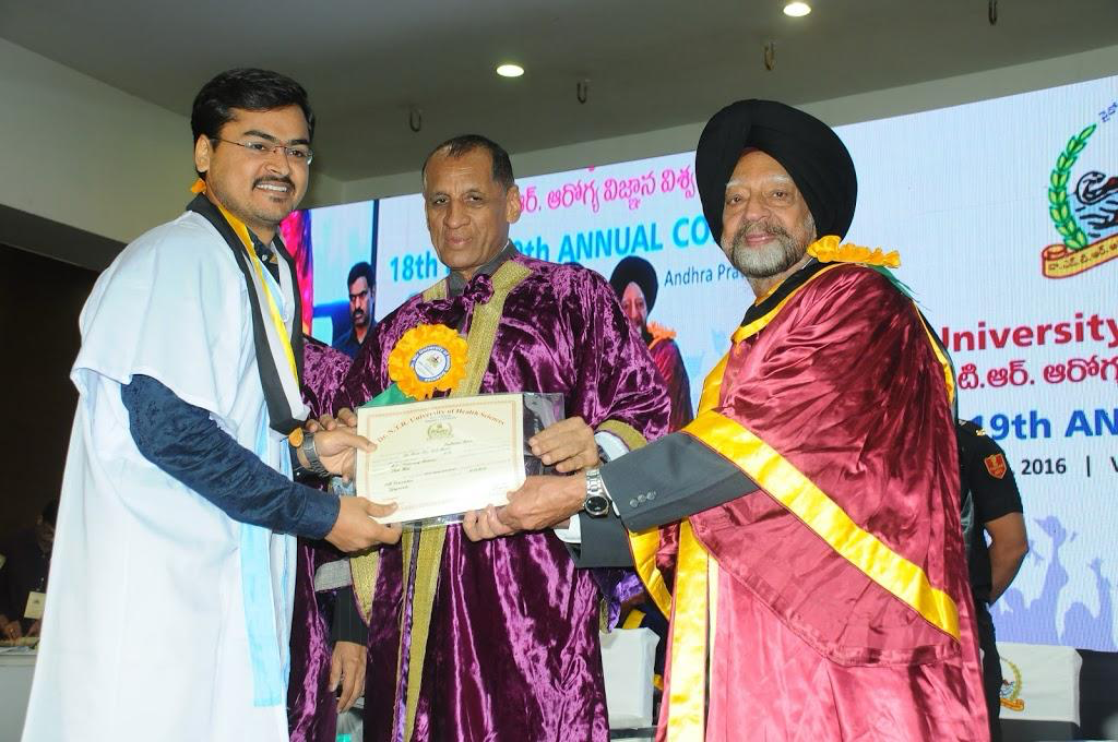 Dr. Rajkumar Korra receiving an award